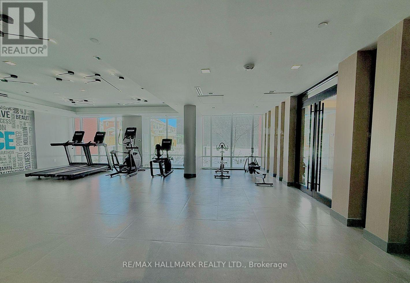 A spacious gym with treadmills, elliptical machines, and other exercise equipment.