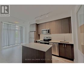 A kitchen with brown cabinets and a white countertop.