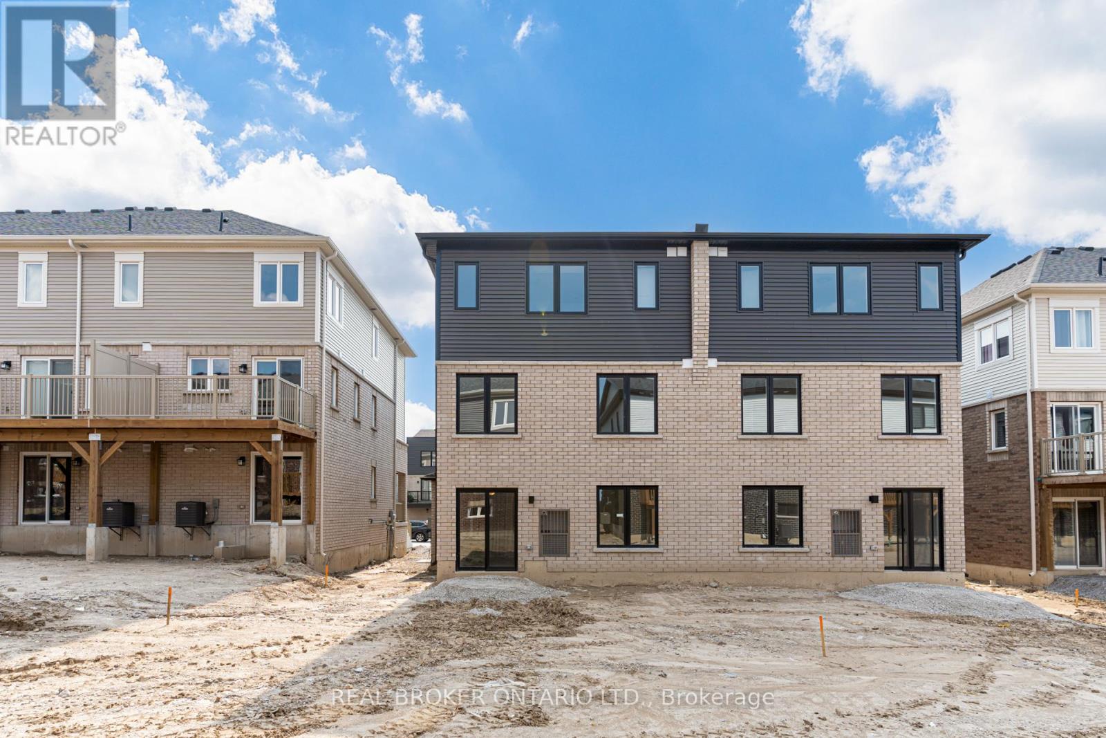 A real estate company is showcasing a newly constructed residential area with multiple houses under development.