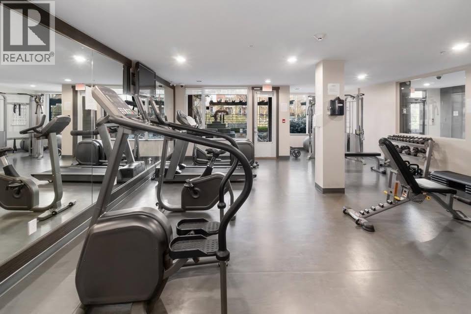 A gym with treadmills and other exercise equipment.