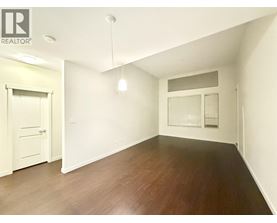 A room with wooden floors and white walls.