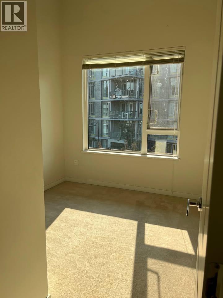 A window with a view of a building outside.