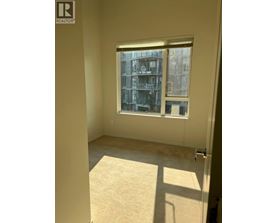 A window with a view of a building outside.