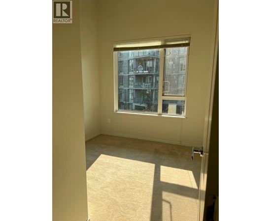 A window with a view of a building outside.