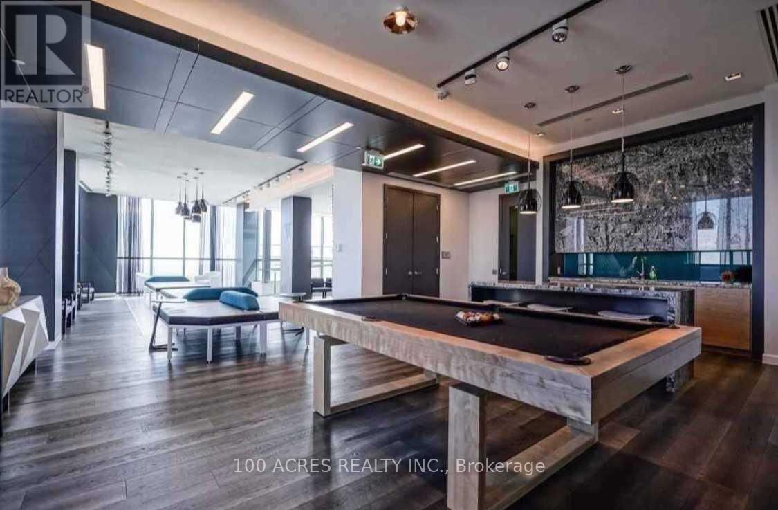 A billiard table is in the middle of a room with a pool table and a ping pong table.