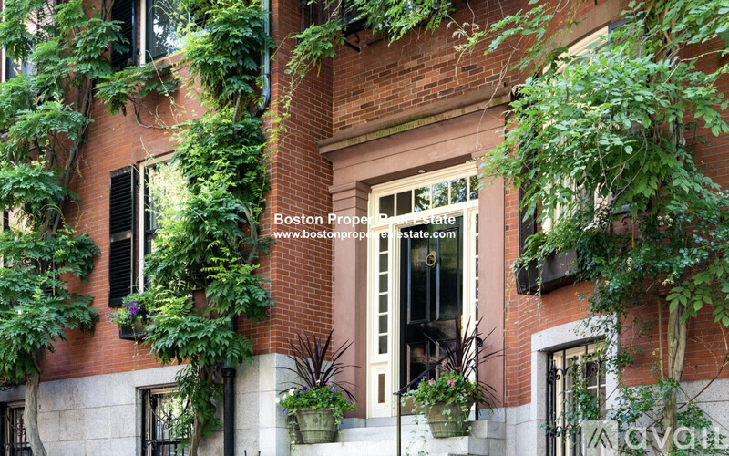 A building with a sign that says Boston Property Estate.
