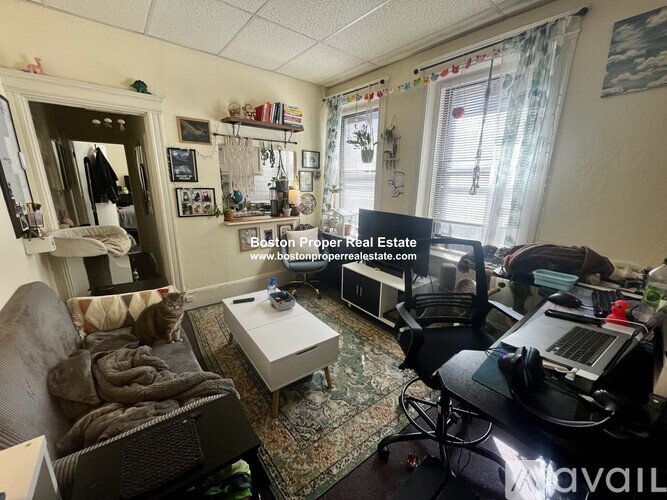 A living room with a couch, chair, and a coffee table.