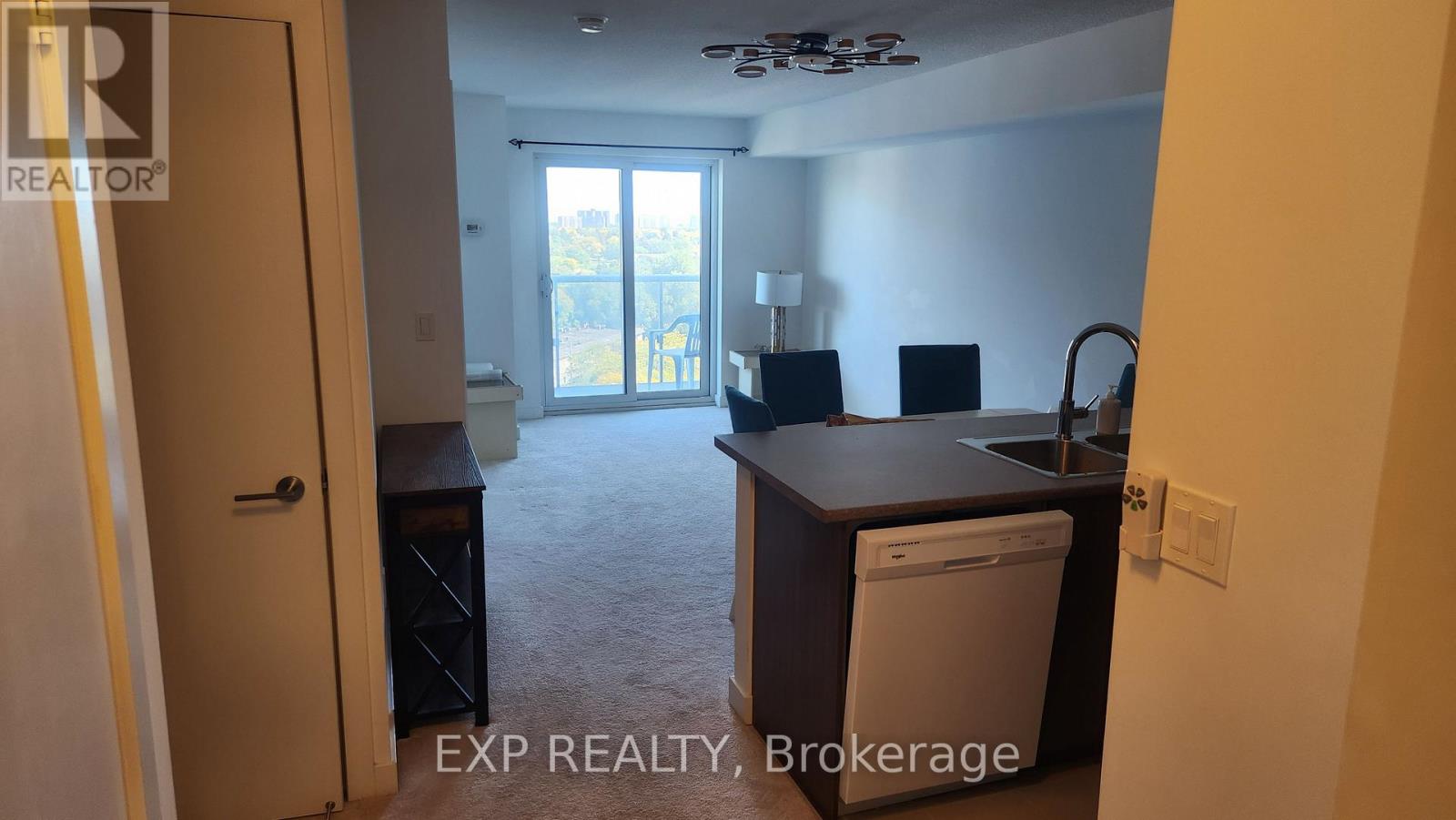 A small, empty room with a washer and dryer in it.