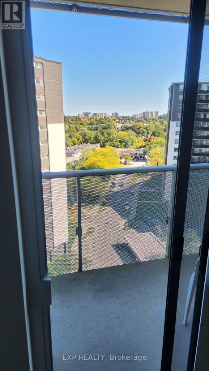 A view from a window looking out at a cityscape.