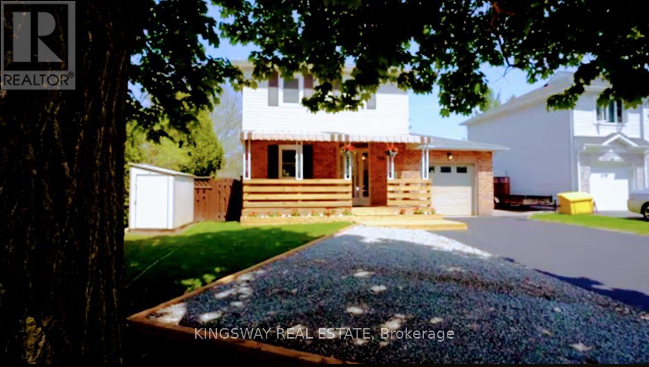 A house with a driveway in front of it.