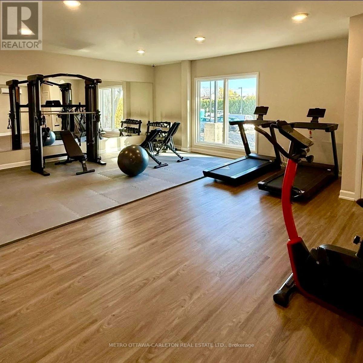 A spacious home gym with a variety of exercise equipment.