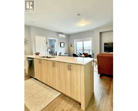 A kitchen with wooden cabinets and a countertop.
