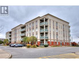 A large apartment building with a parking lot in front.