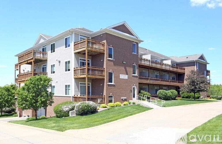 Apartment building with a clear blue sky above.