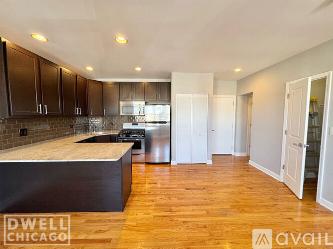 A kitchen with wooden floors and a countertop.