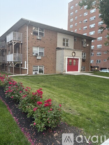 A red door is on the front of a building.