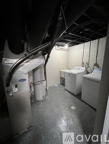 A dirty bathroom with a toilet and sink.
