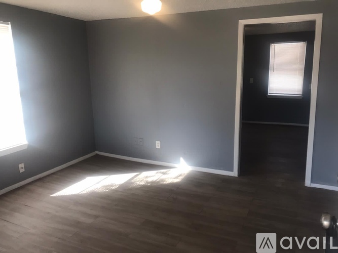 A room with a door and a window.