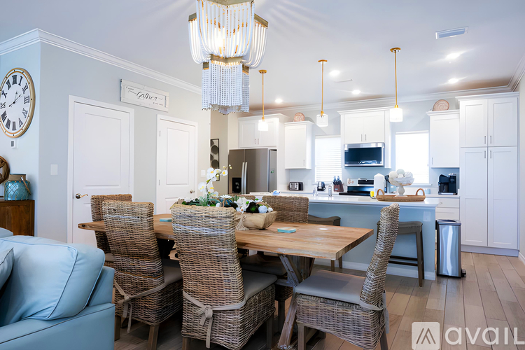 A dining room with a table set for six.