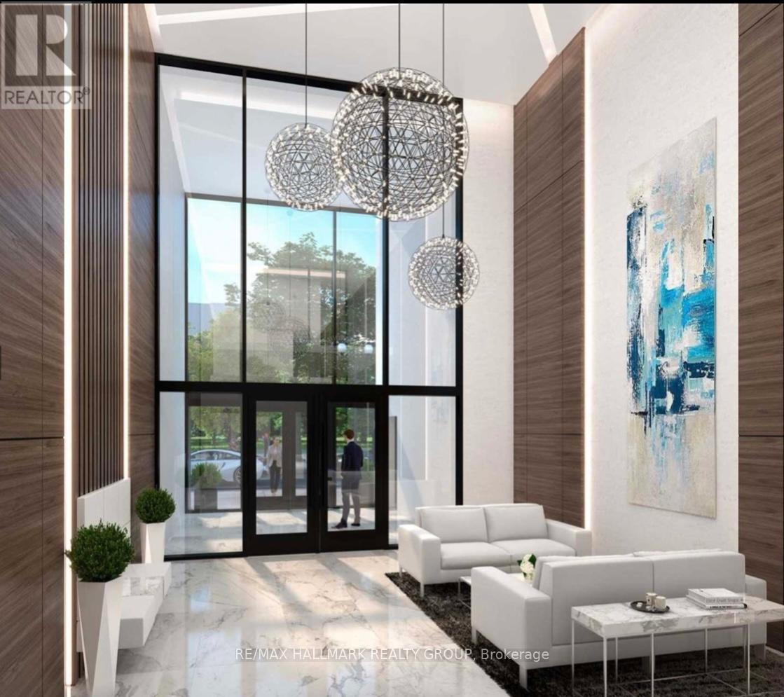 A modern living room with a large chandelier and a painting on the wall.
