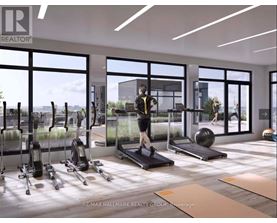 A woman is working out on a treadmill in a spacious gym with various exercise equipment.
