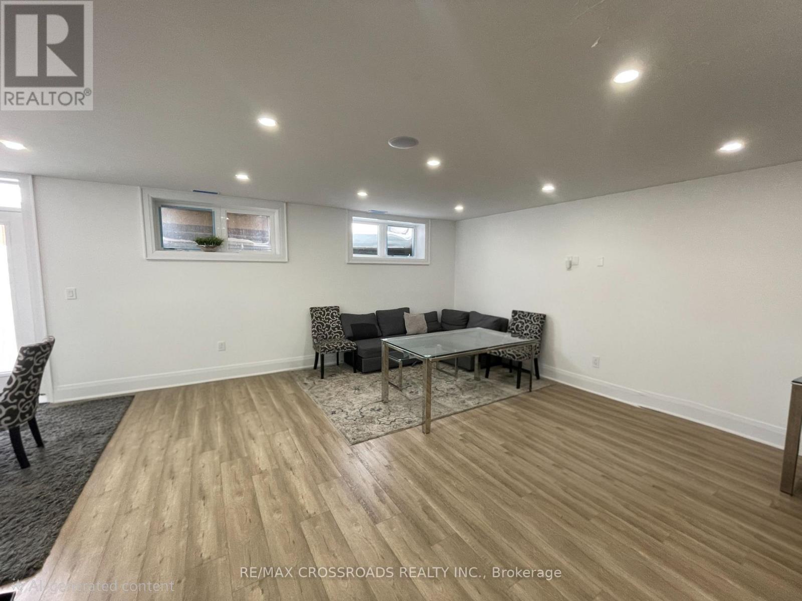 A spacious room with a dining table and chairs.