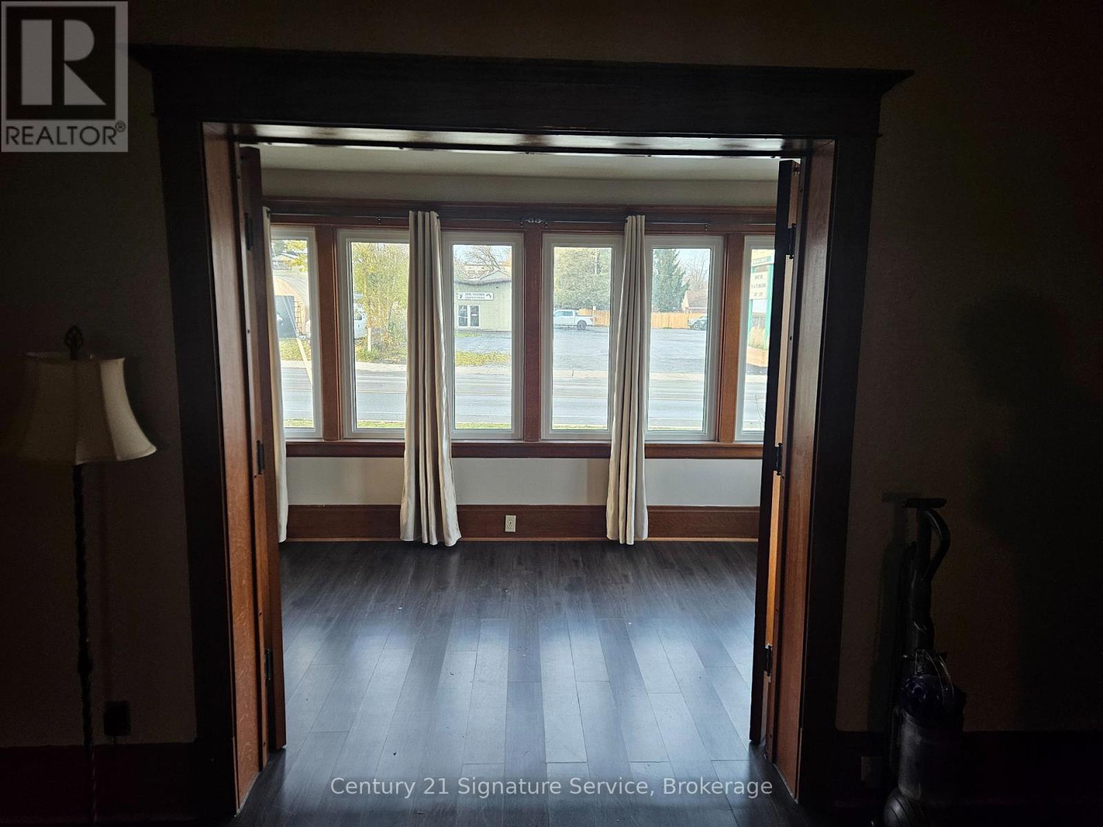 A realtor's office with a view of the street outside.