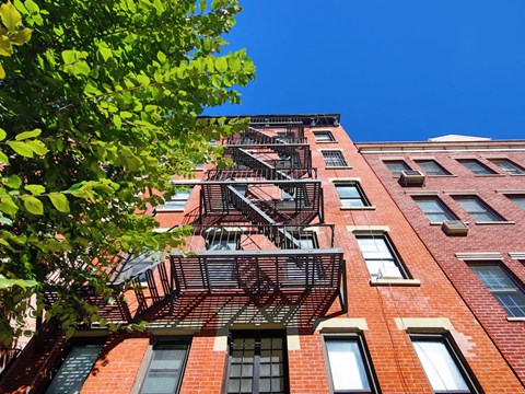a fire escape on the side of a brick building