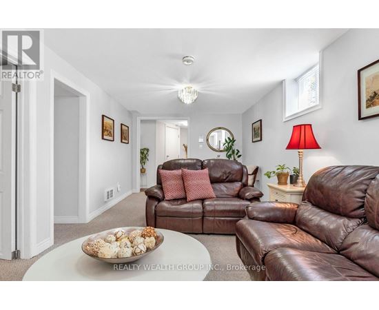 A living room with brown leather couches and a white coffee table.