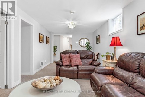 A living room with brown leather couches and a white coffee table.