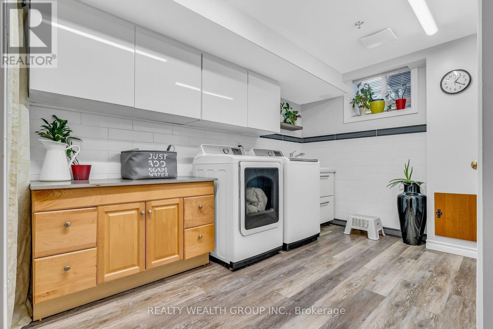 A kitchen with wooden cabinets and a white oven.