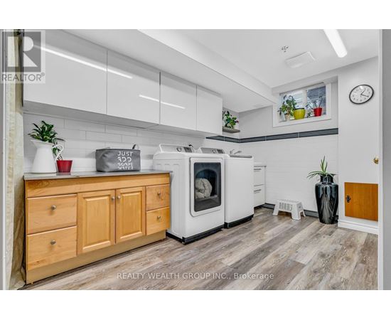 A kitchen with wooden cabinets and a white oven.