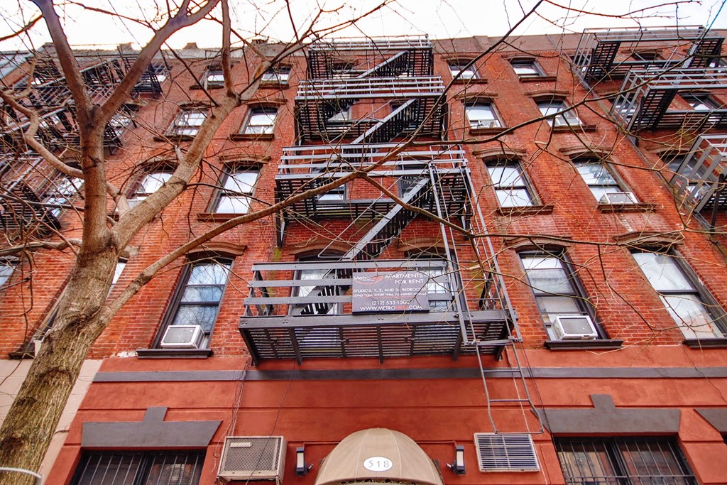 a fire escape on the side of a brick building