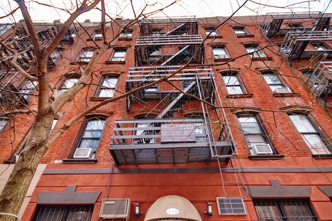 a fire escape on the side of a brick building