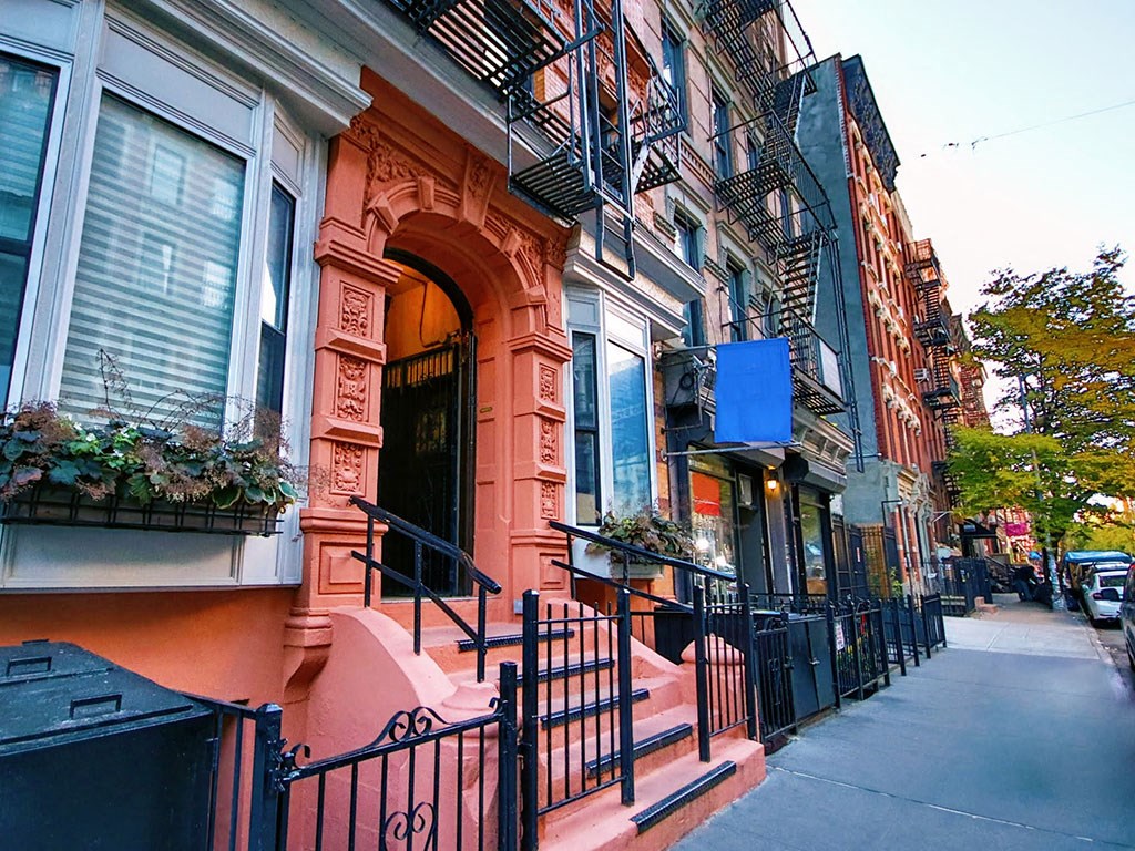 a row of buildings on a city street