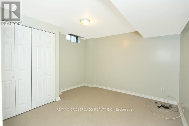 A room with a white door and a window with a white wall.