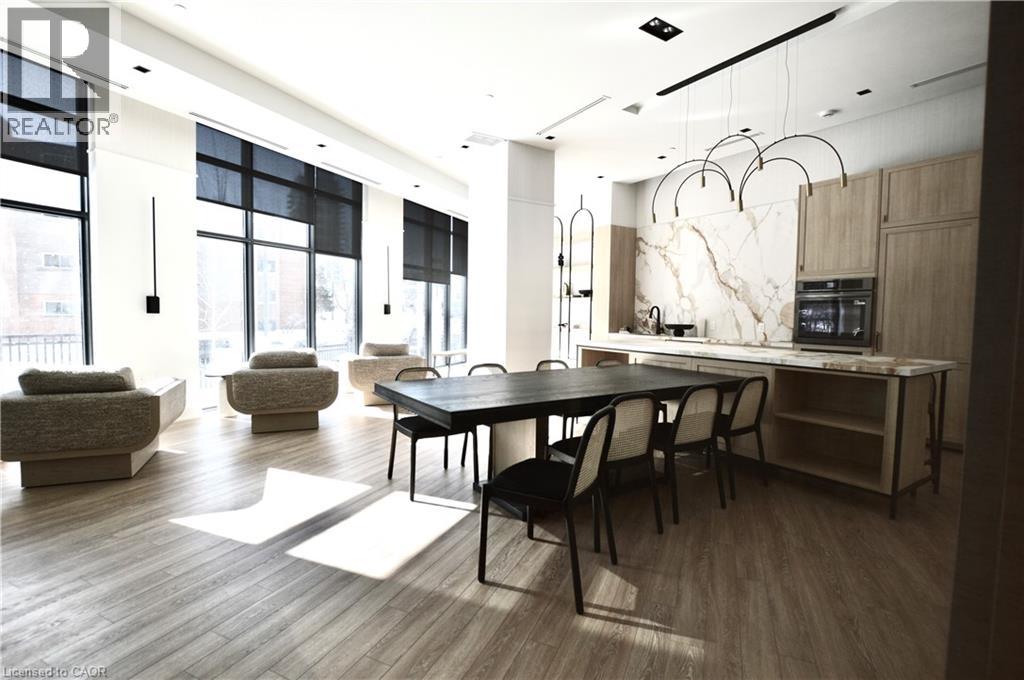 A modern dining room with a large table and chairs.