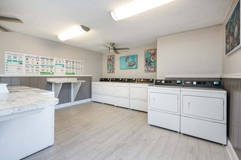 a kitchen with white appliances and counters and a counter top
