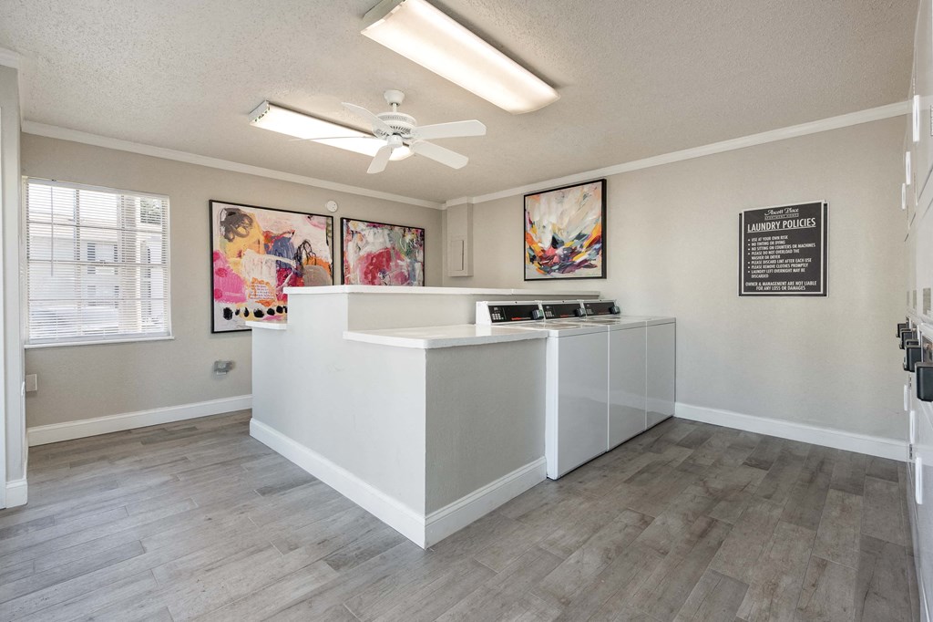 an office with a counter and a ceiling fan