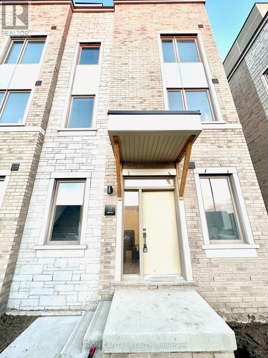 A building with a white door and windows is for sale.
