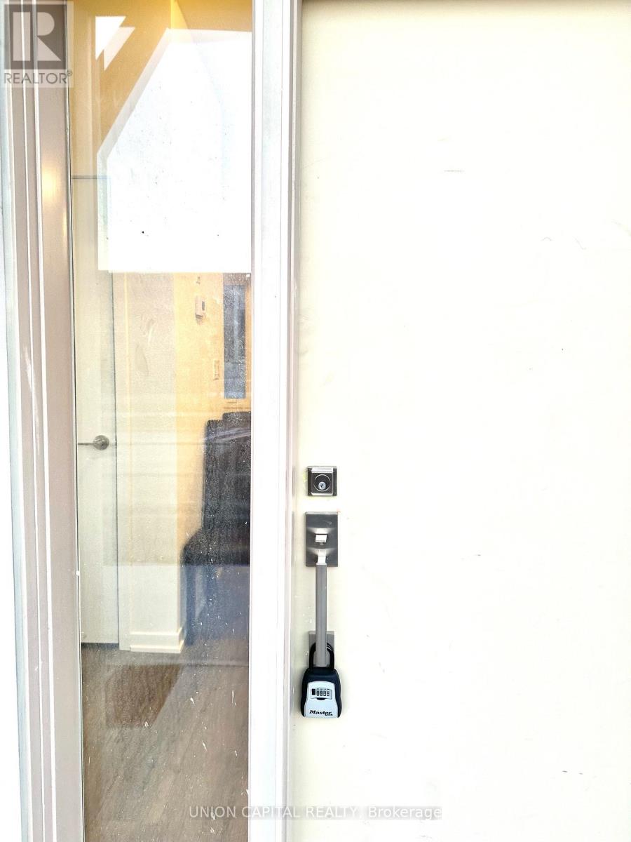 A white door with a Realty logo on it.