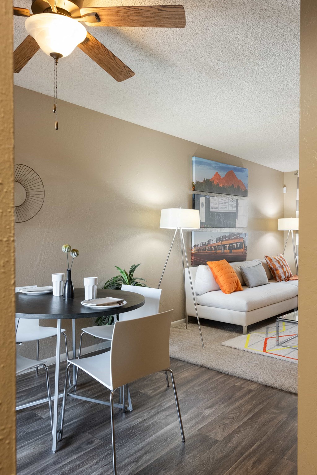 a living room with a dining room table and a couch