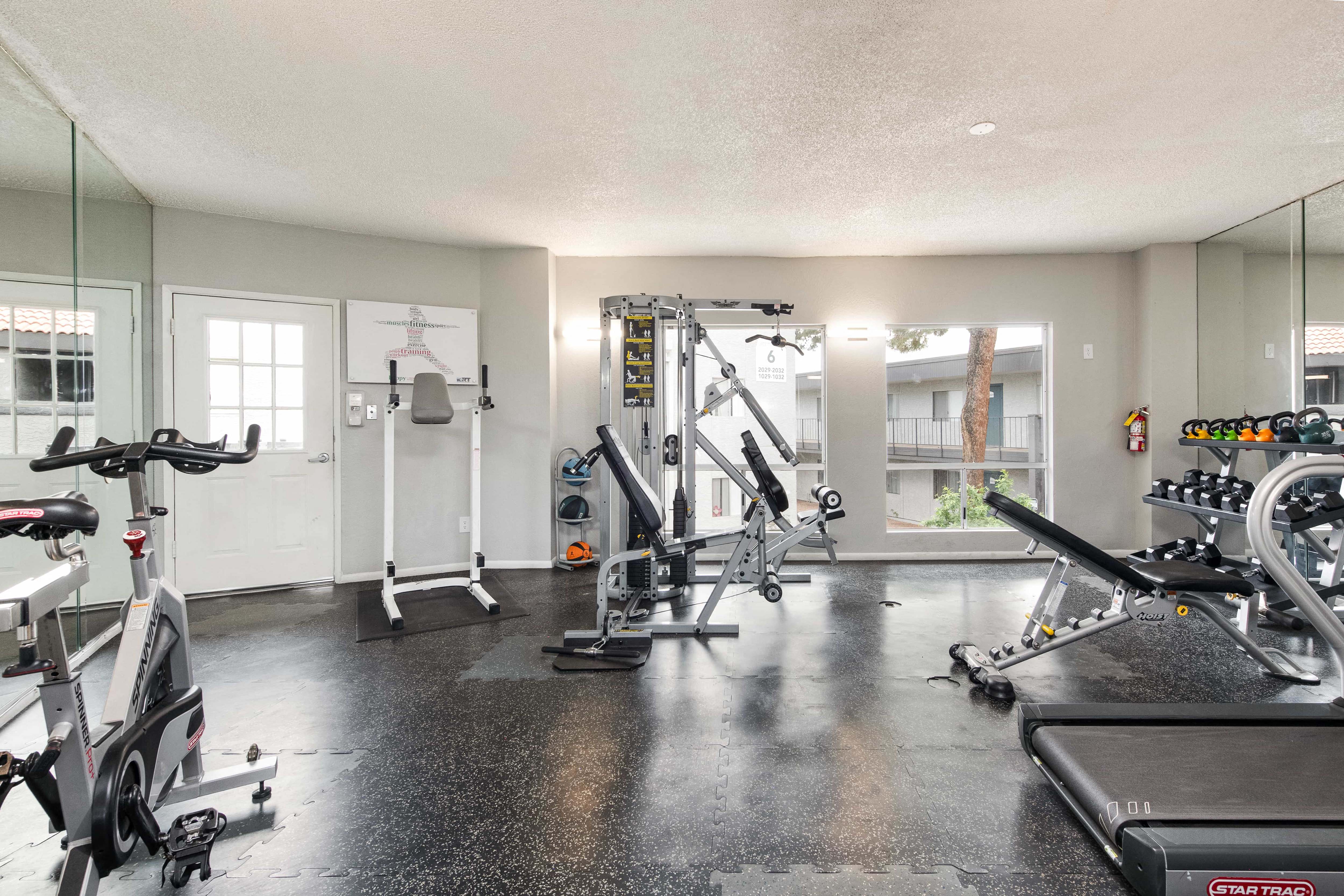 the gym at the flats at big tex apartments