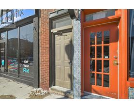 A red door with a glass window is on the right side of the image.