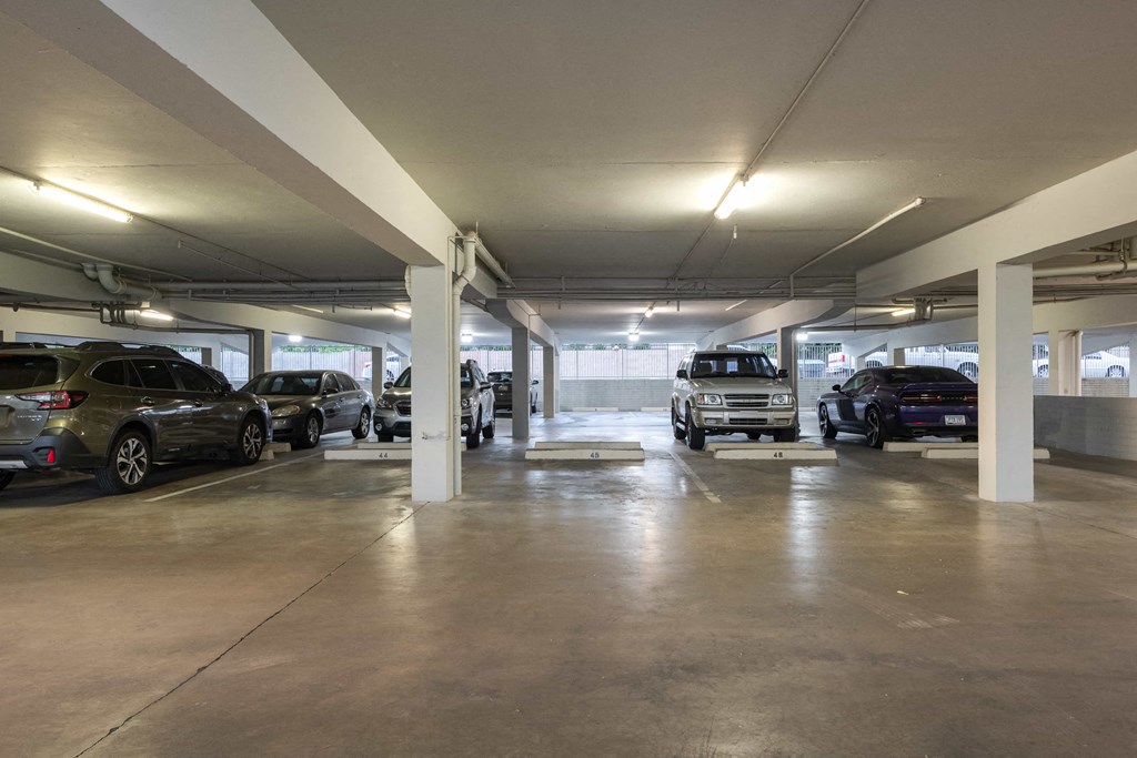 a parking garage with cars parked in it
