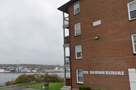 A red brick building with the number 251 and the words Harbourshore on it.