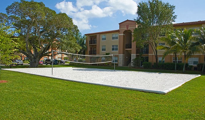 a volleyball court in front of an apartment building