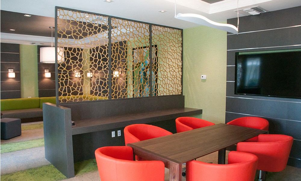 a dining room with a table and chairs and a television