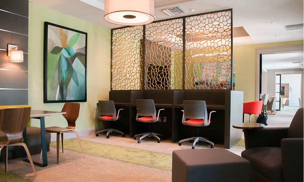 a conference room with chairs and a table in a hotel room