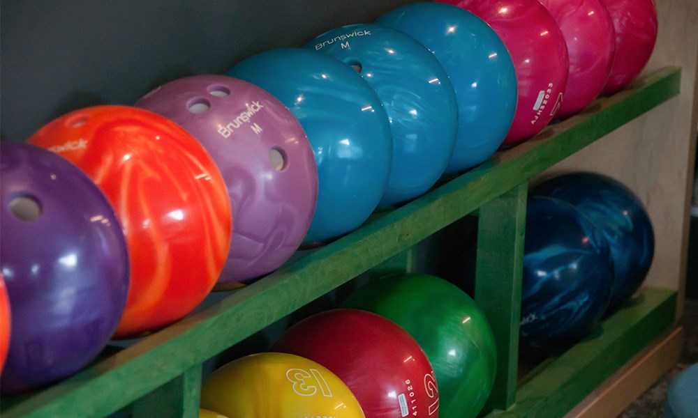 a row of colorful balloons on a shelf